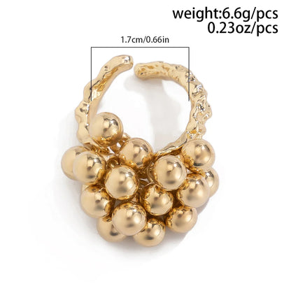 Verstellbarer Ring mit goldenen Kugeln