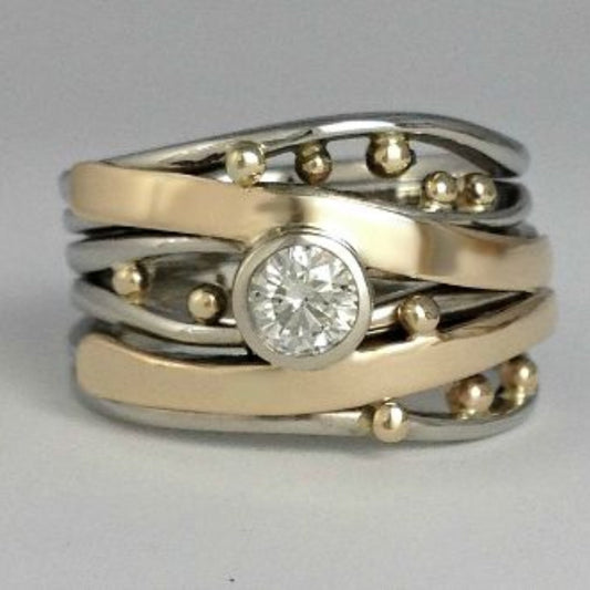 Ring mit Zirkonia in Gold und Silber