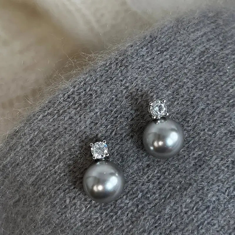 Elegante Ohrringe mit schwarzen Perlen und Zirkonia